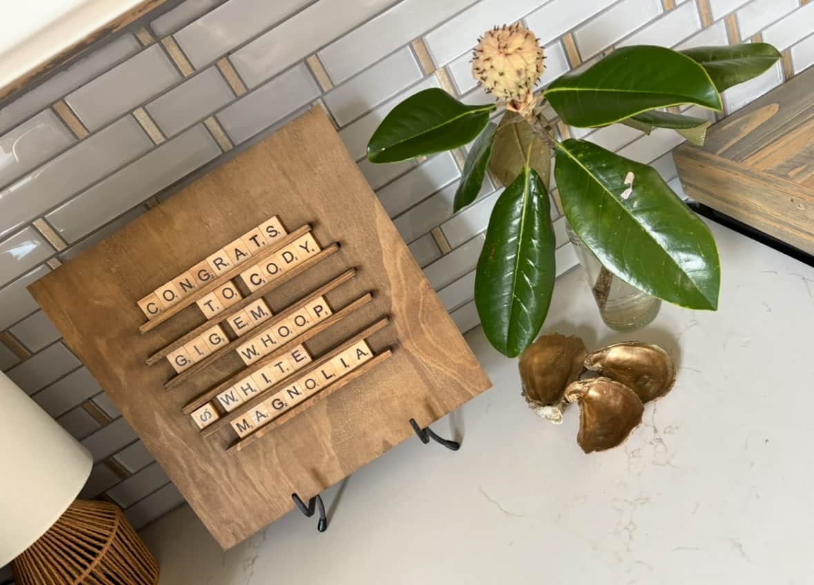 Custom Scrabble tile welcome sign with seasonal florals.
