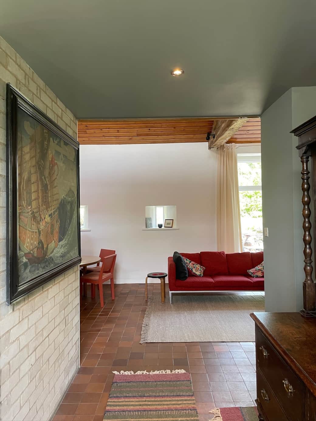 View from the entrance hallway to the living space and a glimpse of the private enclosed rear garden.