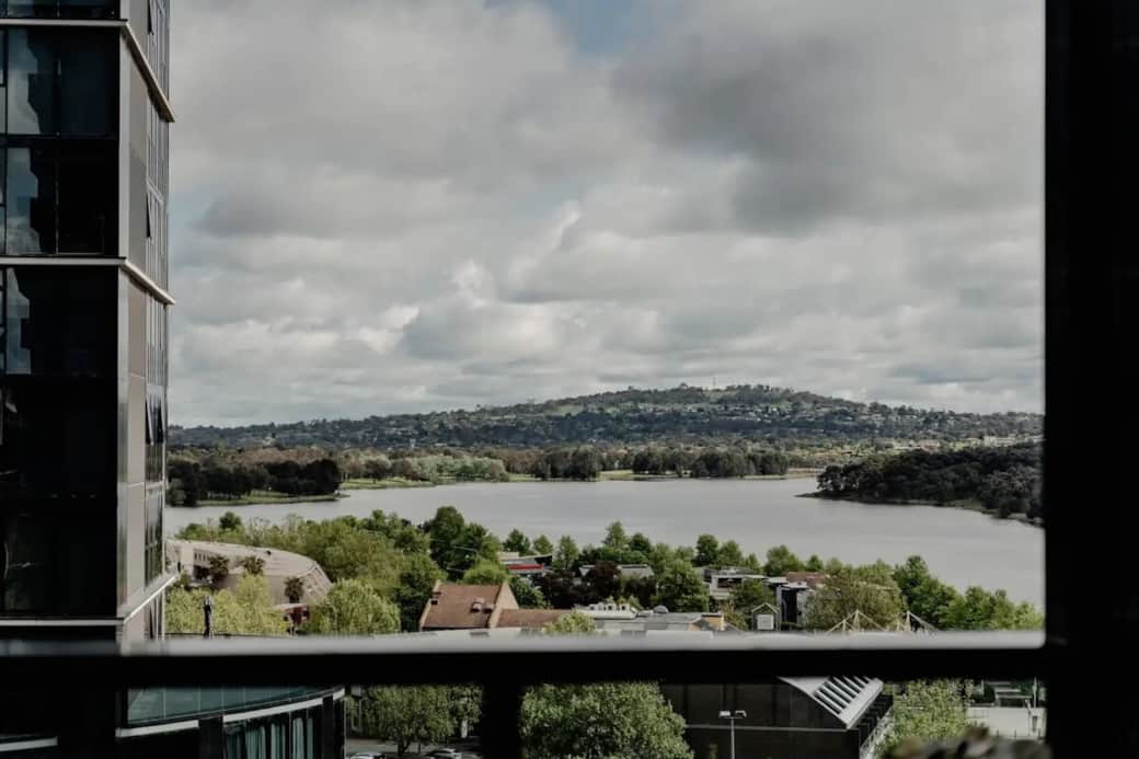 Wake up to breathtaking views of the serene lake right from your bedroom window. The picturesque landscape offers a peaceful backdrop, enhancing your stay with a touch of nature's beauty. This view is sure to make your mornings more delightful .