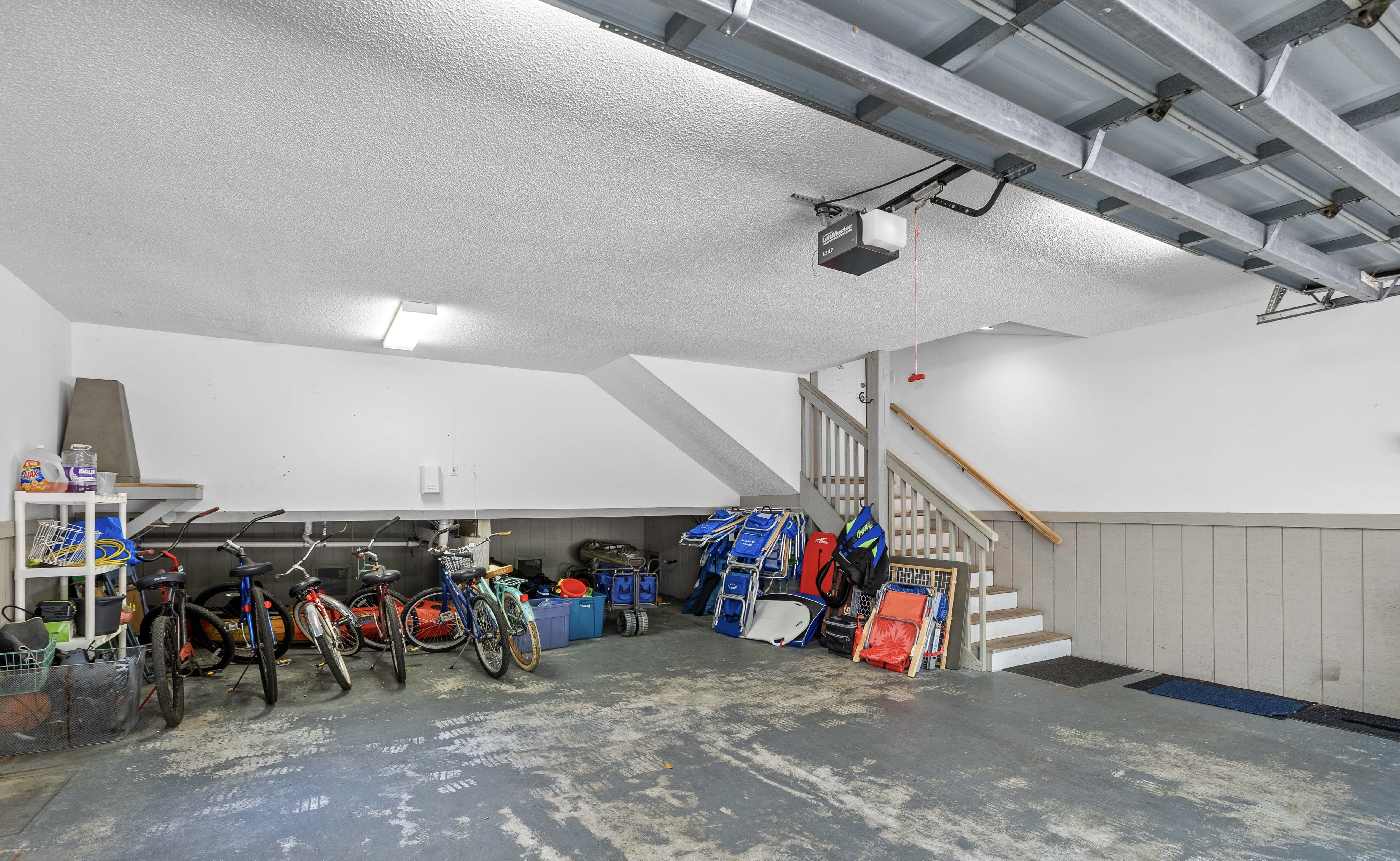 Garage with bikes, beach chairs and beach toys