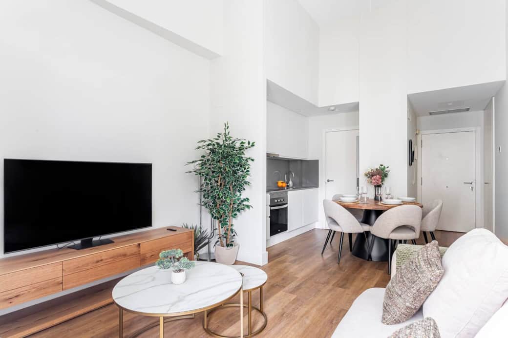 Bright and elegant space with city skyline views, perfect for relaxing or working.