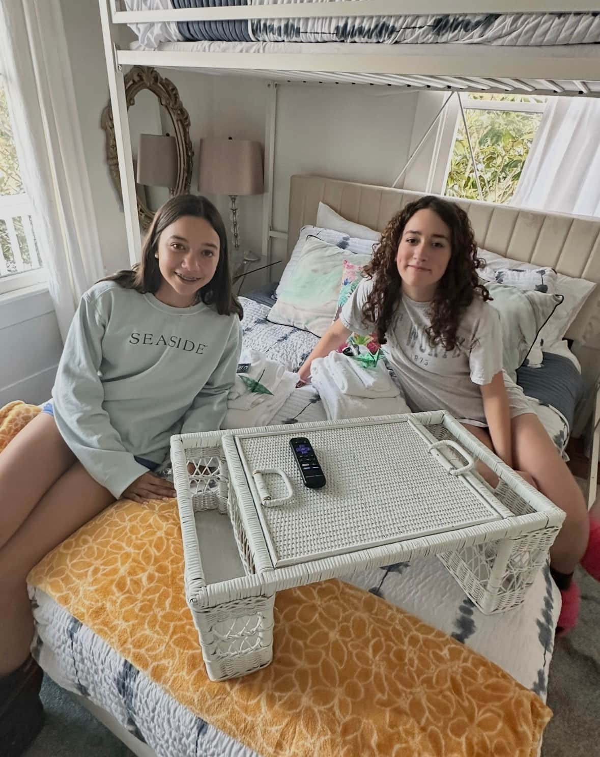 Teen friends hanging out in the bunk room at White Magnolia Galveston