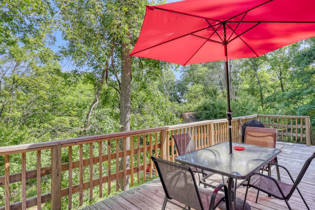 Dine outdoors or unwind on the wraparound deck surrounded by peaceful woods.