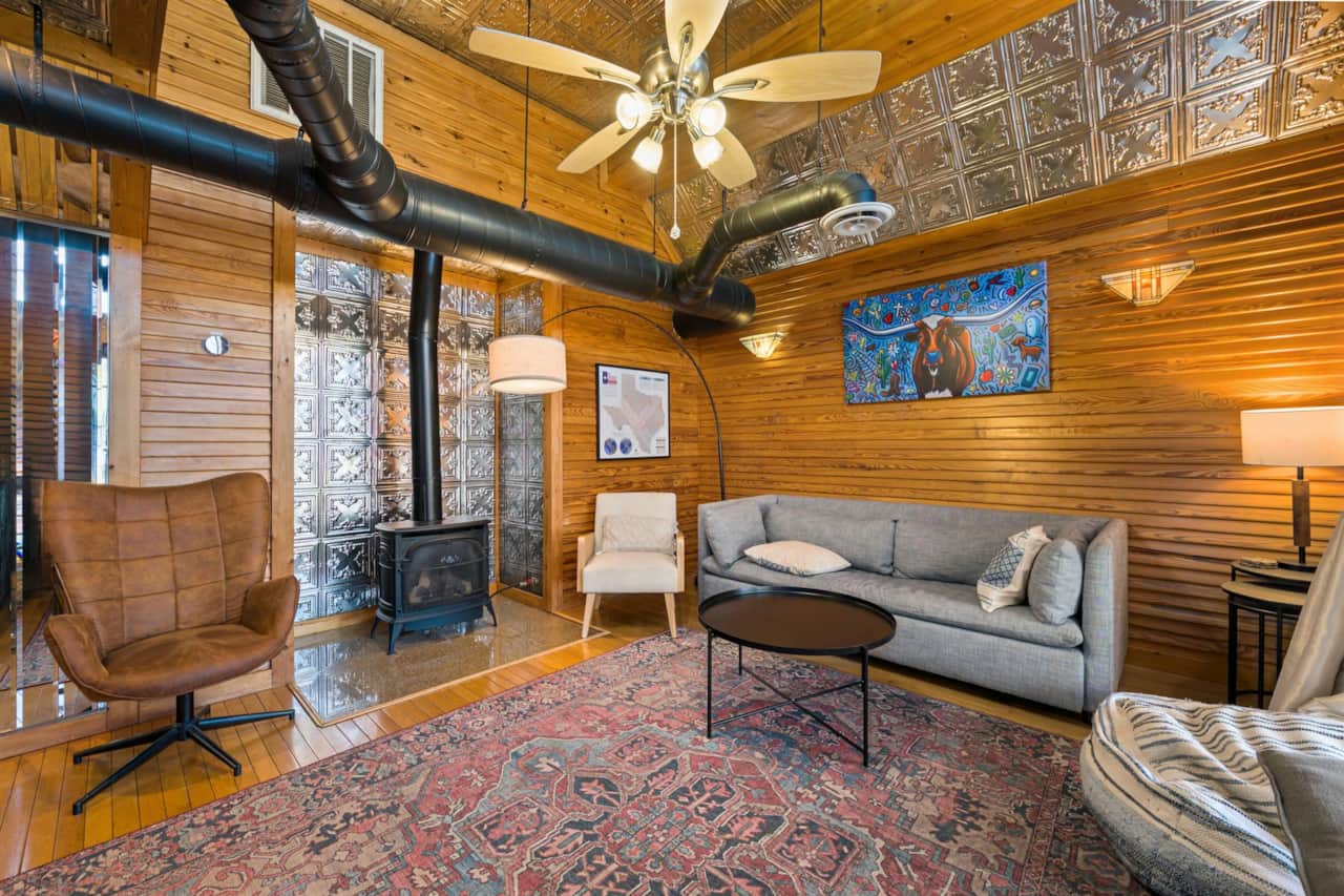 Living Room: Rustic charm meets modern flair with artful decor and inviting seating!