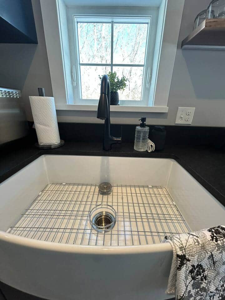 Oversized farmer's sink with a wooded view