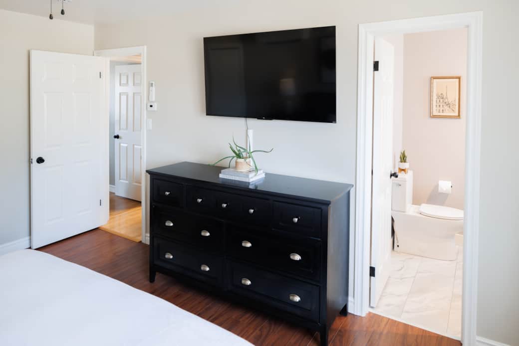 Bright, comfortable master bedroom with king bed