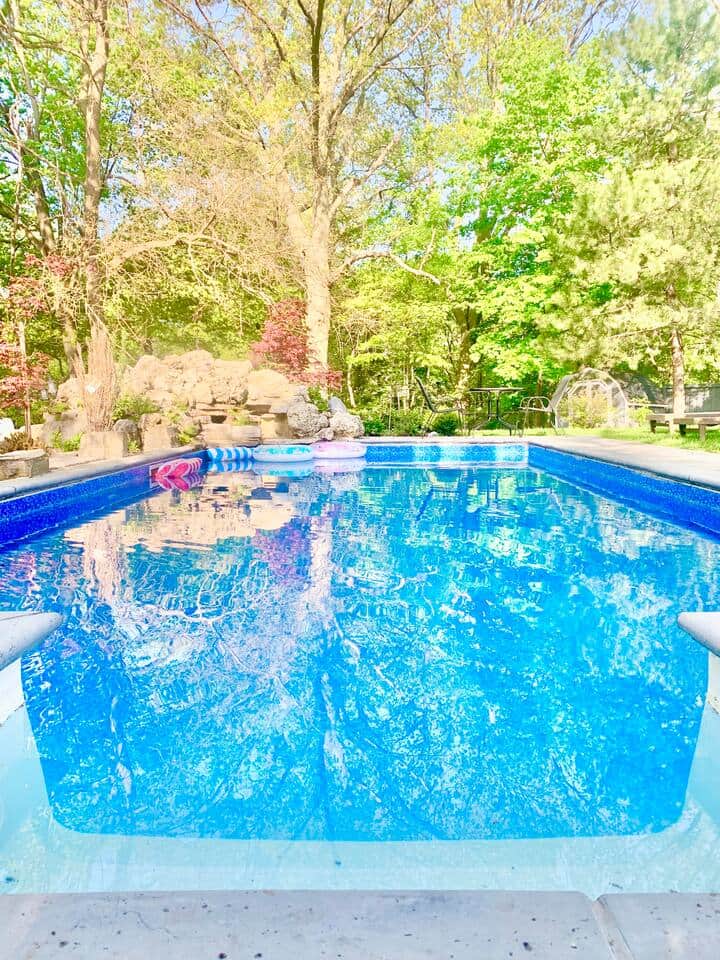 Our backyard offers a true resort like feel with a pool and connected tub, water fall, lounge chairs and a view of the beautiful ravine. 