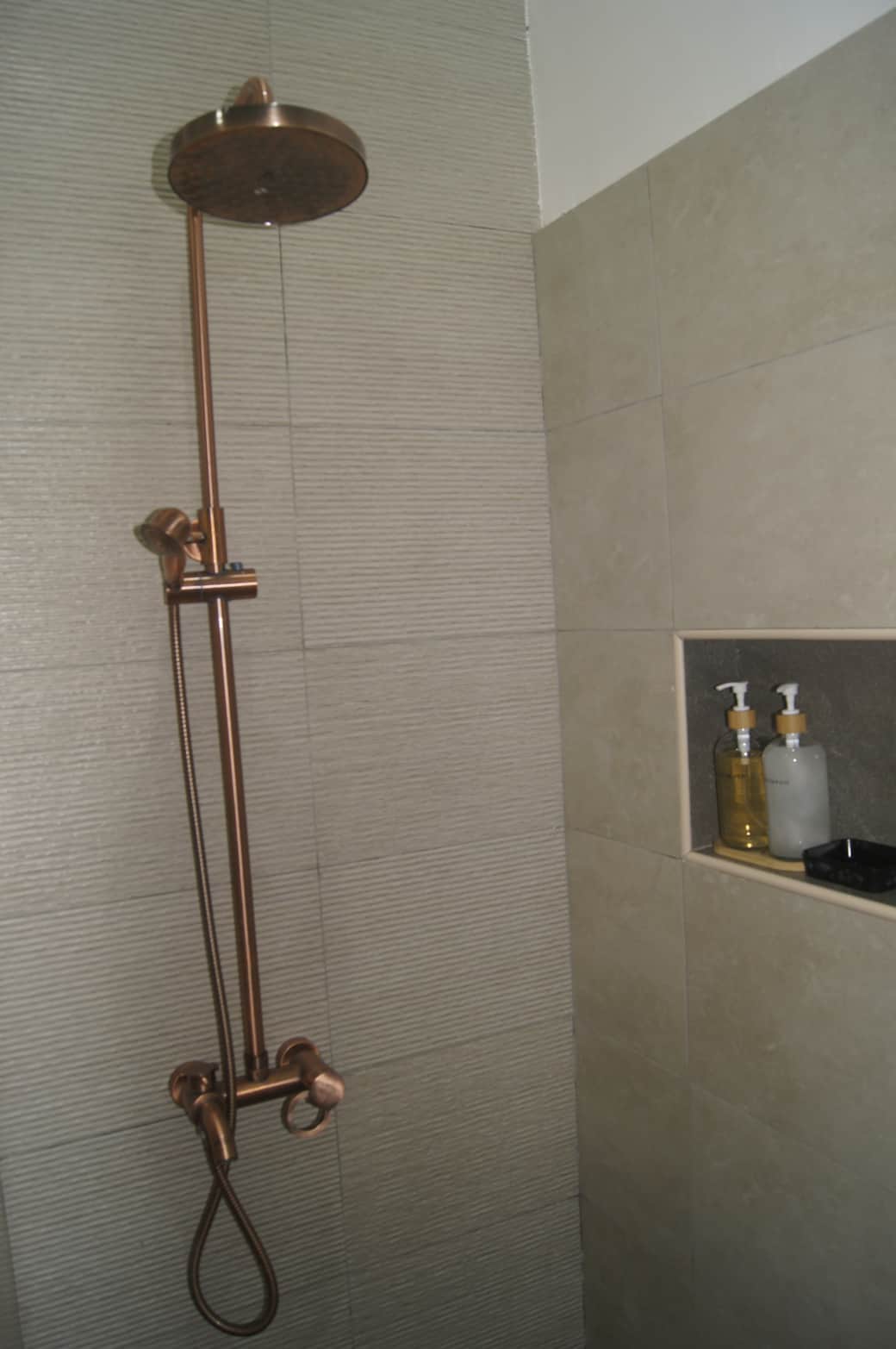 The Red Room Bathroom - Complete shower, keeping with the rustic look