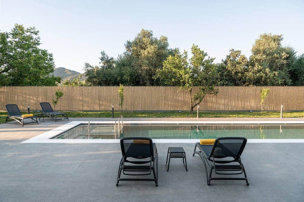 Relaxing near the pool - our orchard behind the fence awaits to be explored
