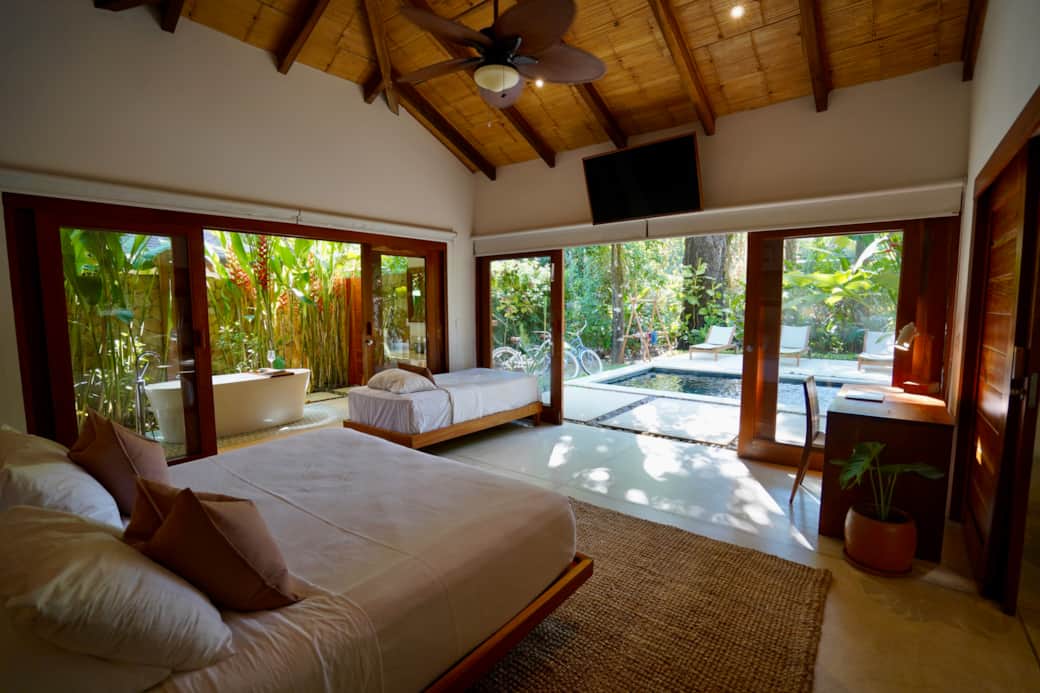Master bedroom, looking out to the beautiful bathtub and saltwater pool