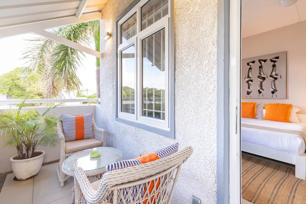 View of cozy small balcony and bed area