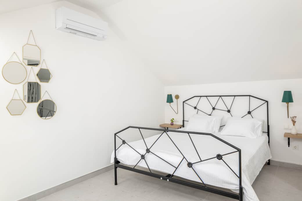 Cool comfort in West Bedroom. AC & stylish mirrors enhance your restful Hvar retreat. Cool comfort in West Bedroom. AC & stylish mirrors enhance your restful Hvar retreat.