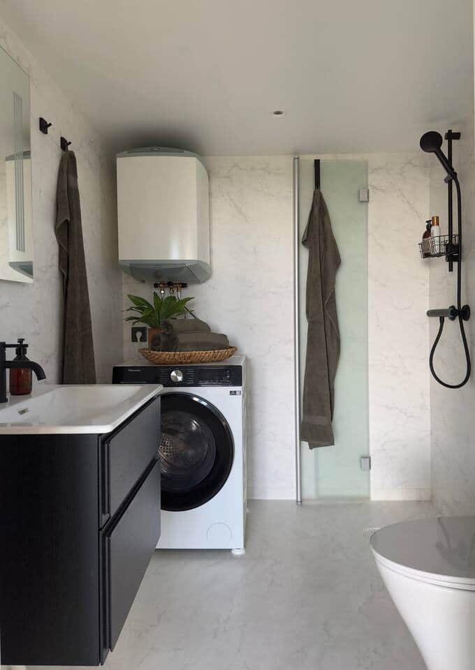 Bathroom with shower and a combined washing and tumble dryer