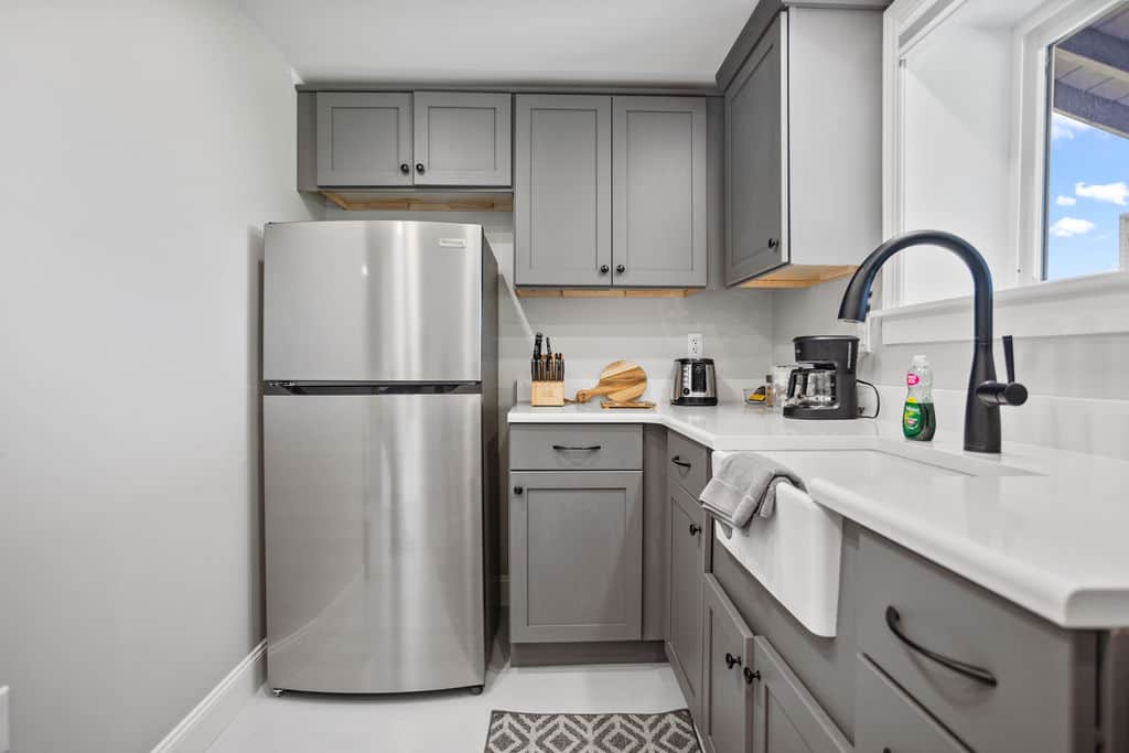 Efficiency kitchen, coffee pot with basket filter, shared BBQ outdoors. 