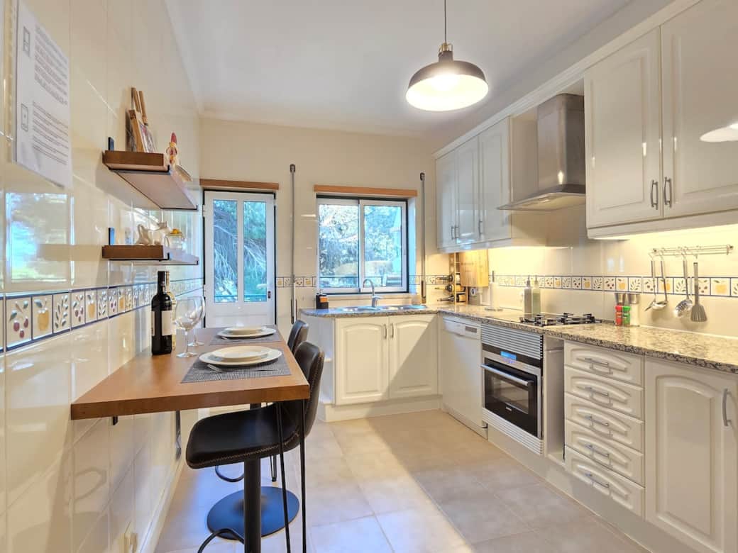 Bright kitchen with breakfast bar seating—perfect for morning coffee or a quick meal.