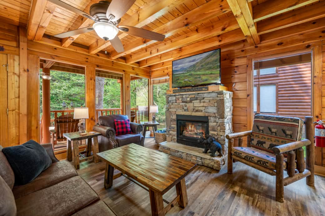 Cozy up by the stone fireplace on the full sofa, loveseat or cabin chair at the ready