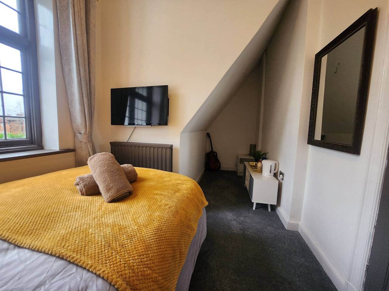 Comfortable bedroom at 239 Seymour Grove accommodation Manchester