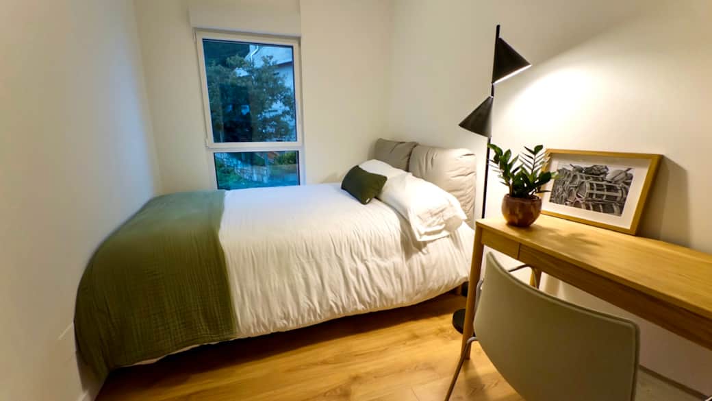Cozy bedroom with work desk — ideal for remote work Cozy bedroom with work desk — ideal for remote work