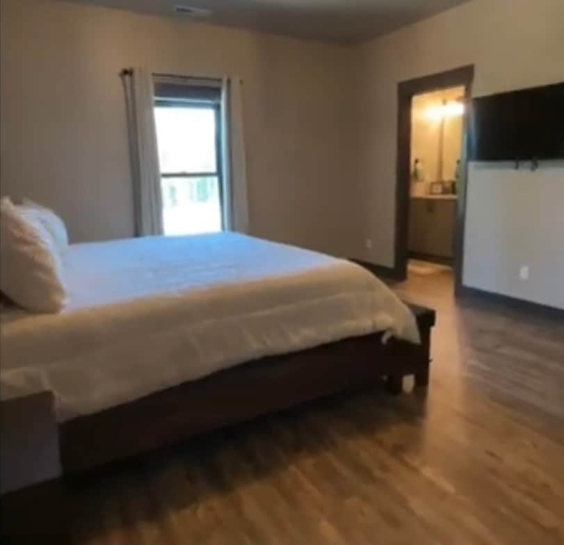 2nd bedroom with king and attached bath with shower