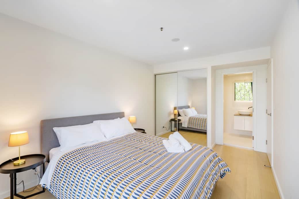 Immerse yourself in the comfort of our master bedroom, featuring a plush queen-sized bed and soft, inviting linens.  The attached bathroom ensures convenience and privacy, making this space ideal for a peaceful stay.