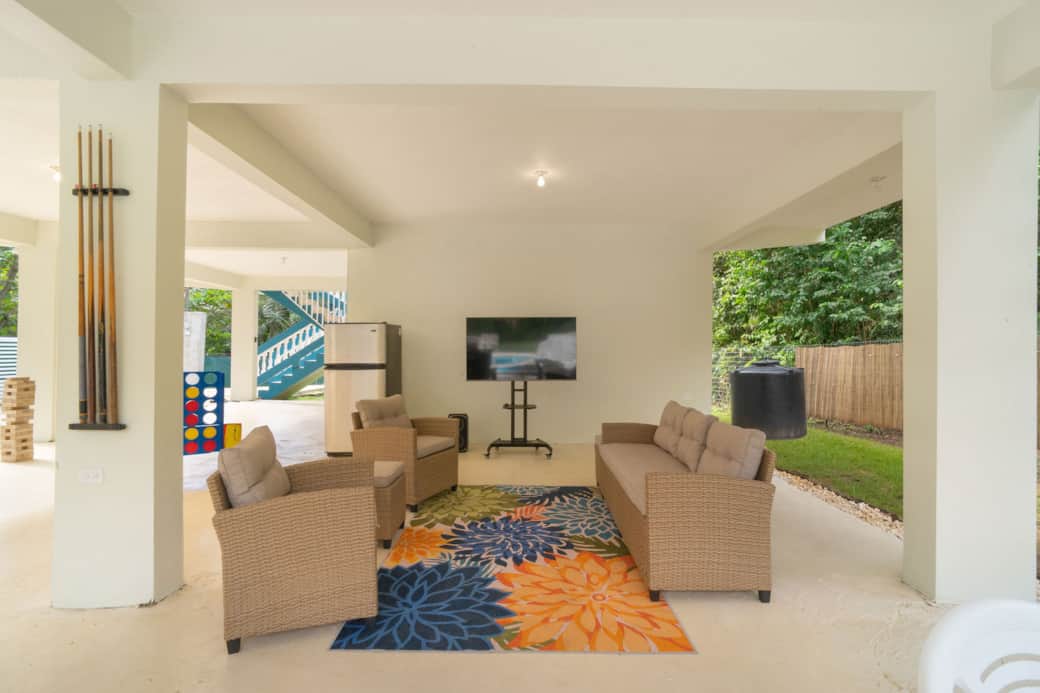 First floor cover patio seating and TV