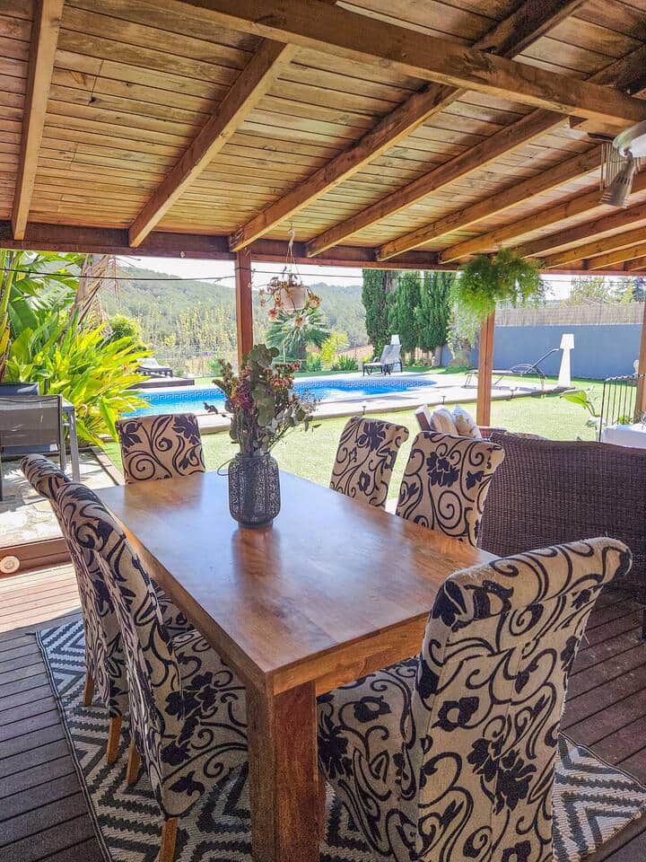 Enjoy meals outdoors at the dining table, with seating for six guests and beautiful views of the sur