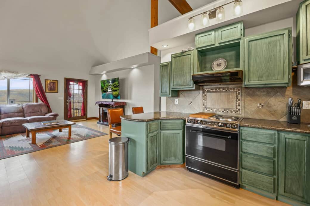 Prepare delicious meals in a bright kitchen with granite countertops, modern appliances, and plenty of space for cooking, baking, and sharing favorite family recipes just minutes from Park City Mountain Resort.