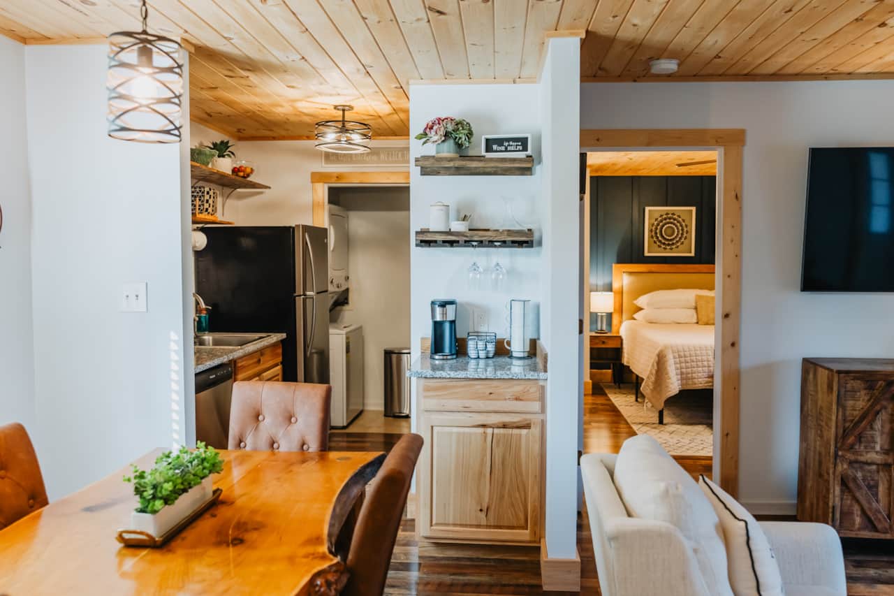 A view of the dining room and kitchen from the second Master Bedroom