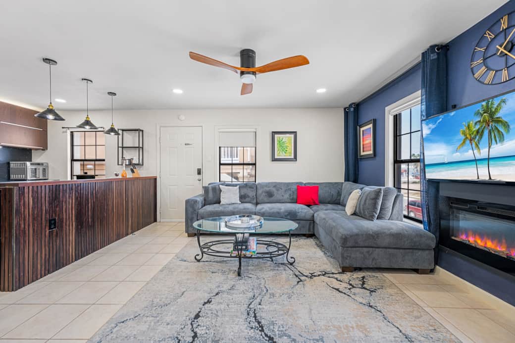 Large sofa, TV can be viewedfrom kitchen.