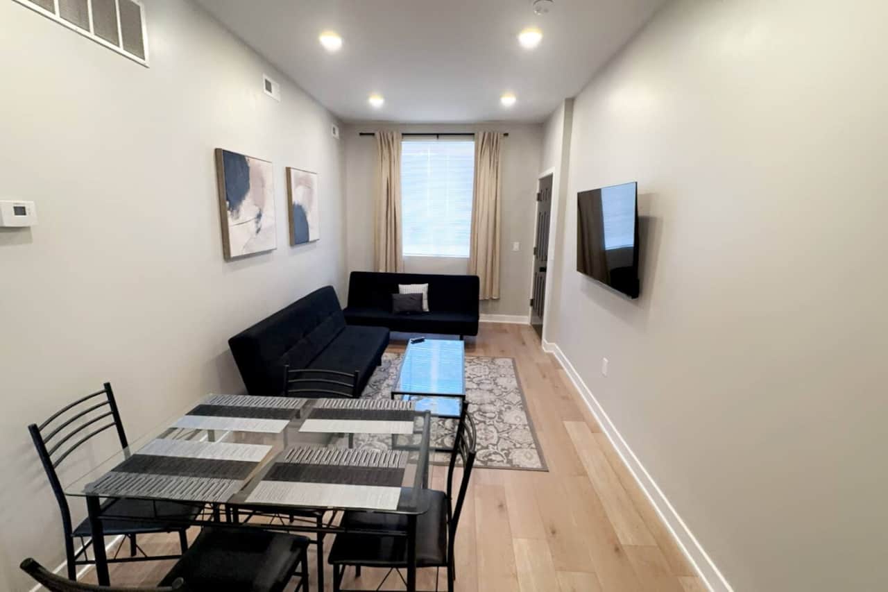 Living room with everything you need for a relaxing stay: a flat-screen TV with Roku channels and high-speed WiFi. Additionally, our living room is equipped with two comfortable sofa beds for extra guests or a cozy night in.
