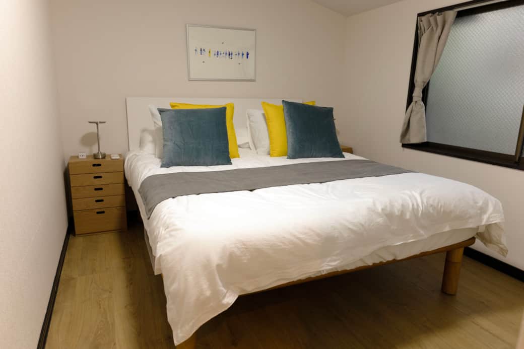 A calm and cosy bedroom setup designed for restful nights after exploring Tokyo shopping A calm and cosy bedroom setup designed for restful nights after exploring Tokyo shopping