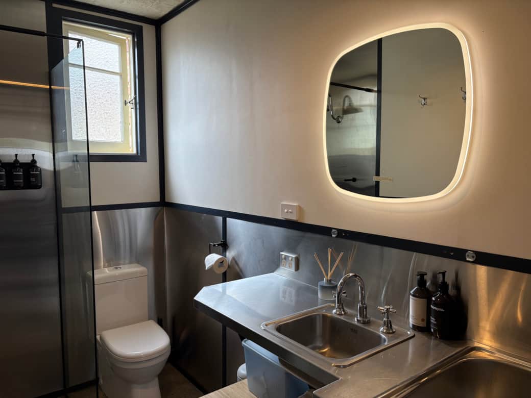 Bathroom with walk-in shower, vanity and Thankyou toiletries.
