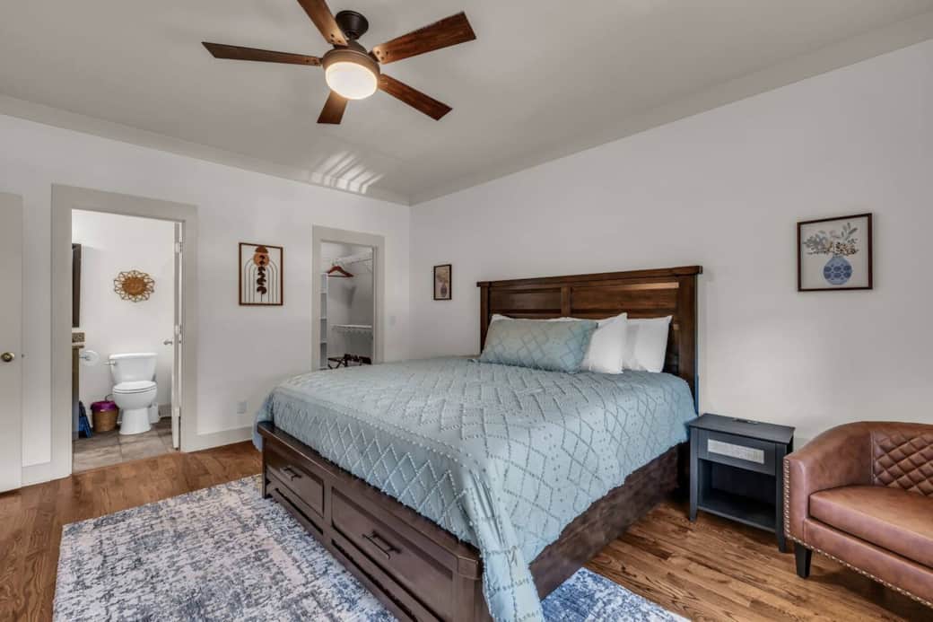 This main floor king suite has ample natural light and an expansive view overlooking the front of the property.
