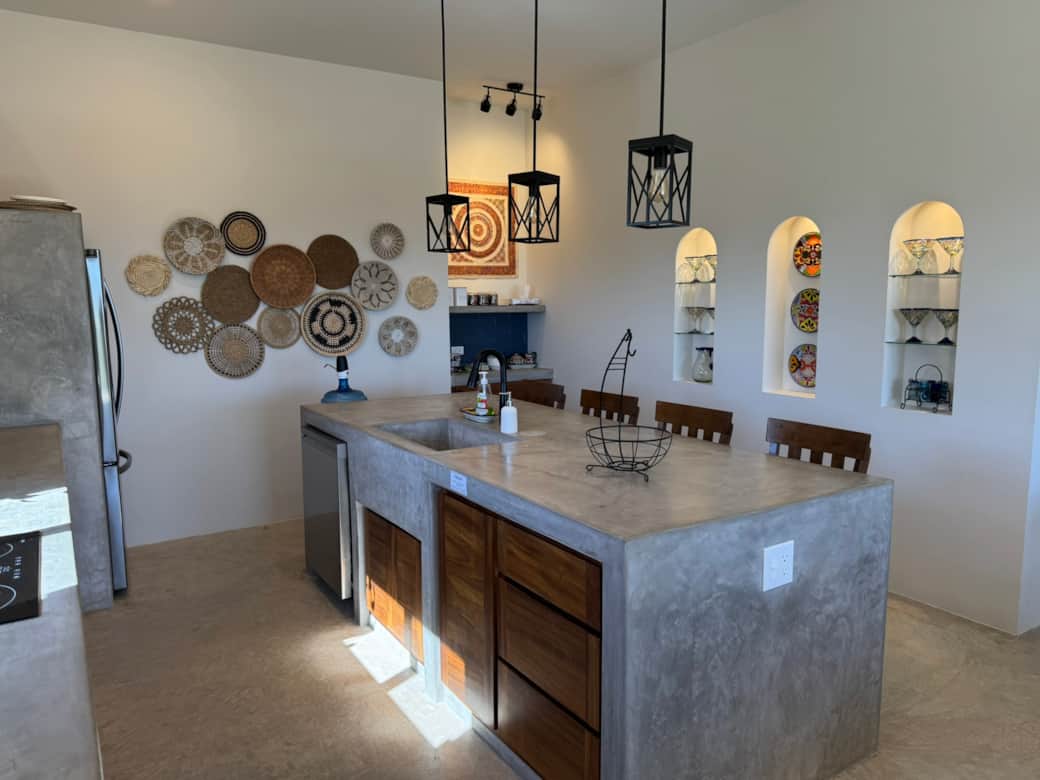 Fully stocked kitchen with large sink, blender, dishwasher, and easy-access drawers for convenience