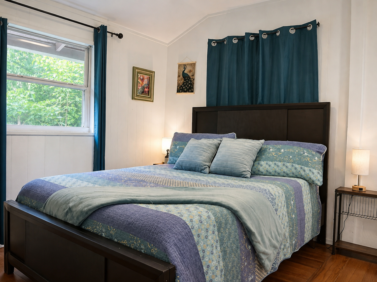 Cozy Peacock Room with a queen bed and sound machine for a restful night’s sleep.