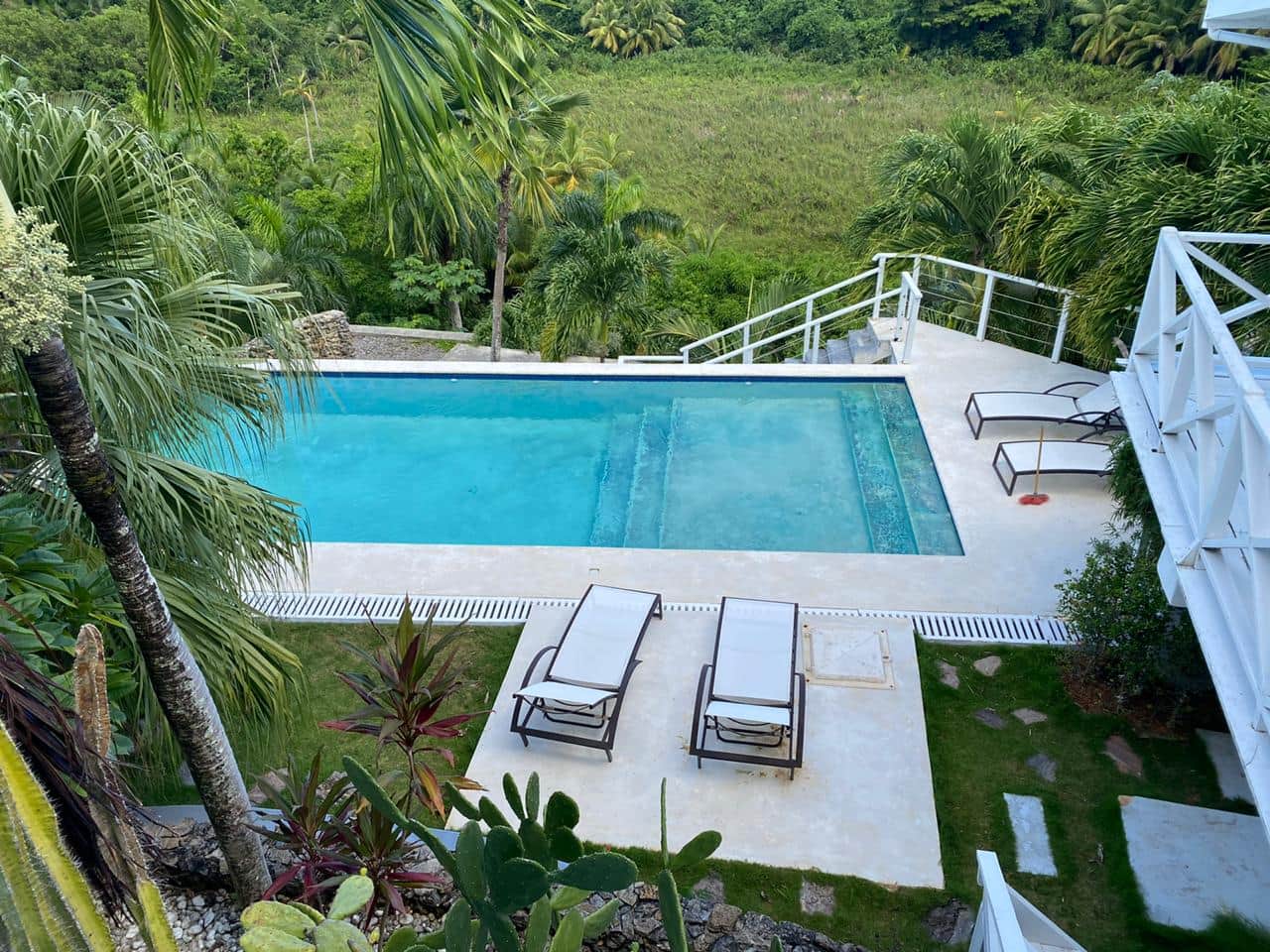 Upper terrace with loungers overlooking gardens at Casa Valentine, Las Terrenas