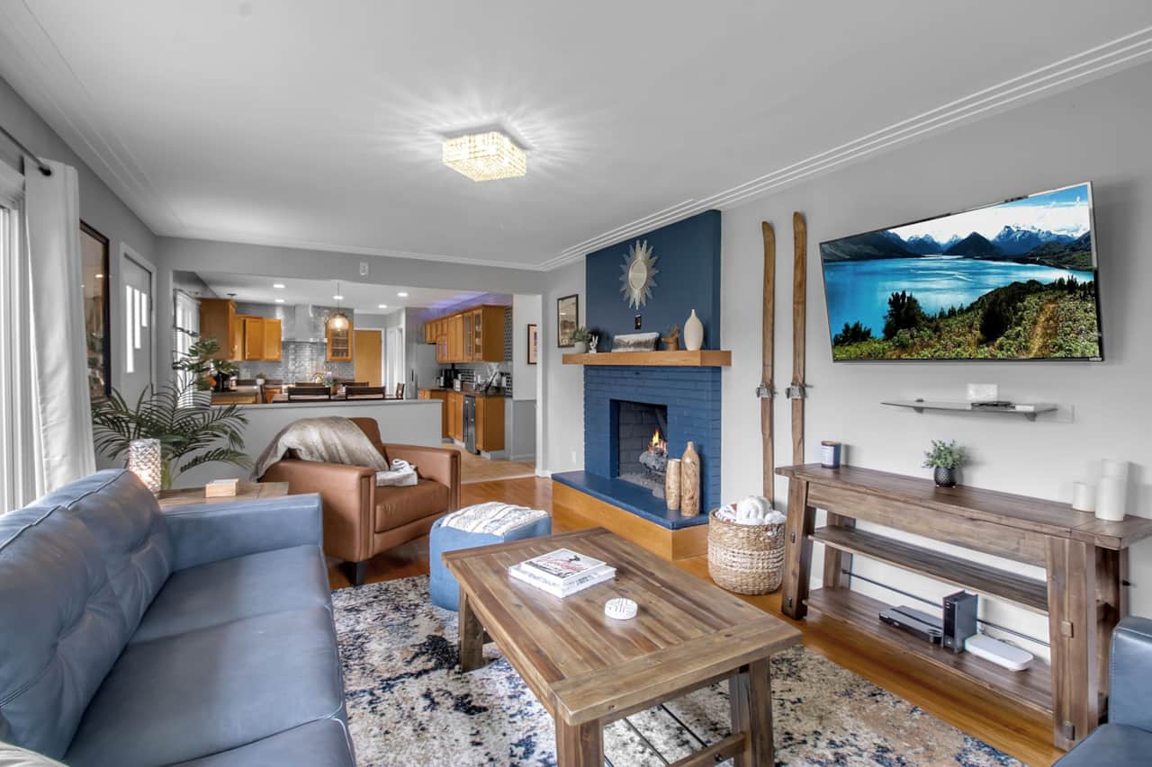 Cozy living room with fireplace, smart tv, and open layout perfect for gatherings.