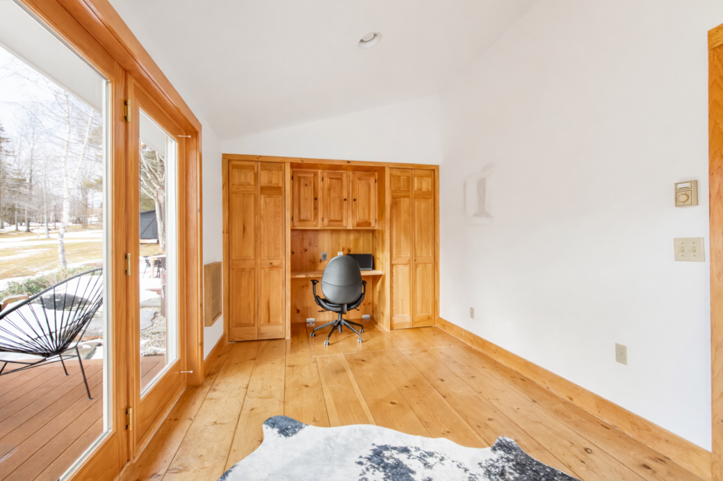 Dedicated workspace or flexible bonus room accessible through the primary bedroom with natural light
