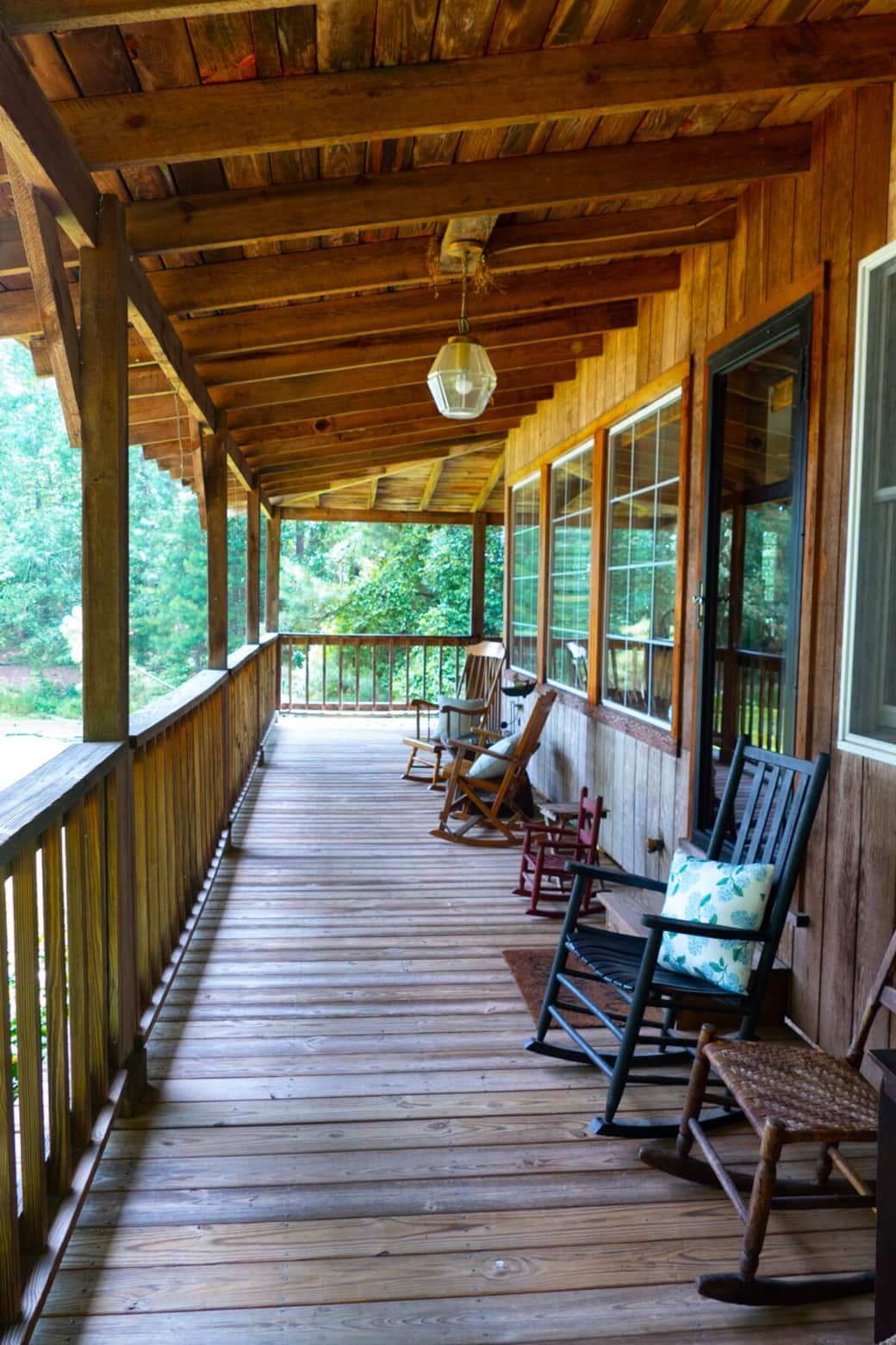 The wide and inviting wrap-around porch boasts a variety of seating. 