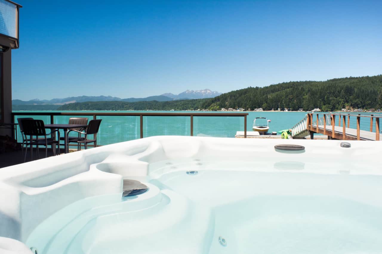 The hot tub with views, next to a wall to provide privacy from the next door property. Operated 24/7