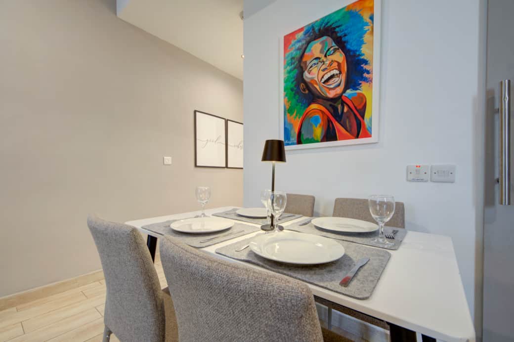 Bright open-plan studio with fully equipped kitchenette and dining space Bright open-plan studio with fully equipped kitchenette and dining space