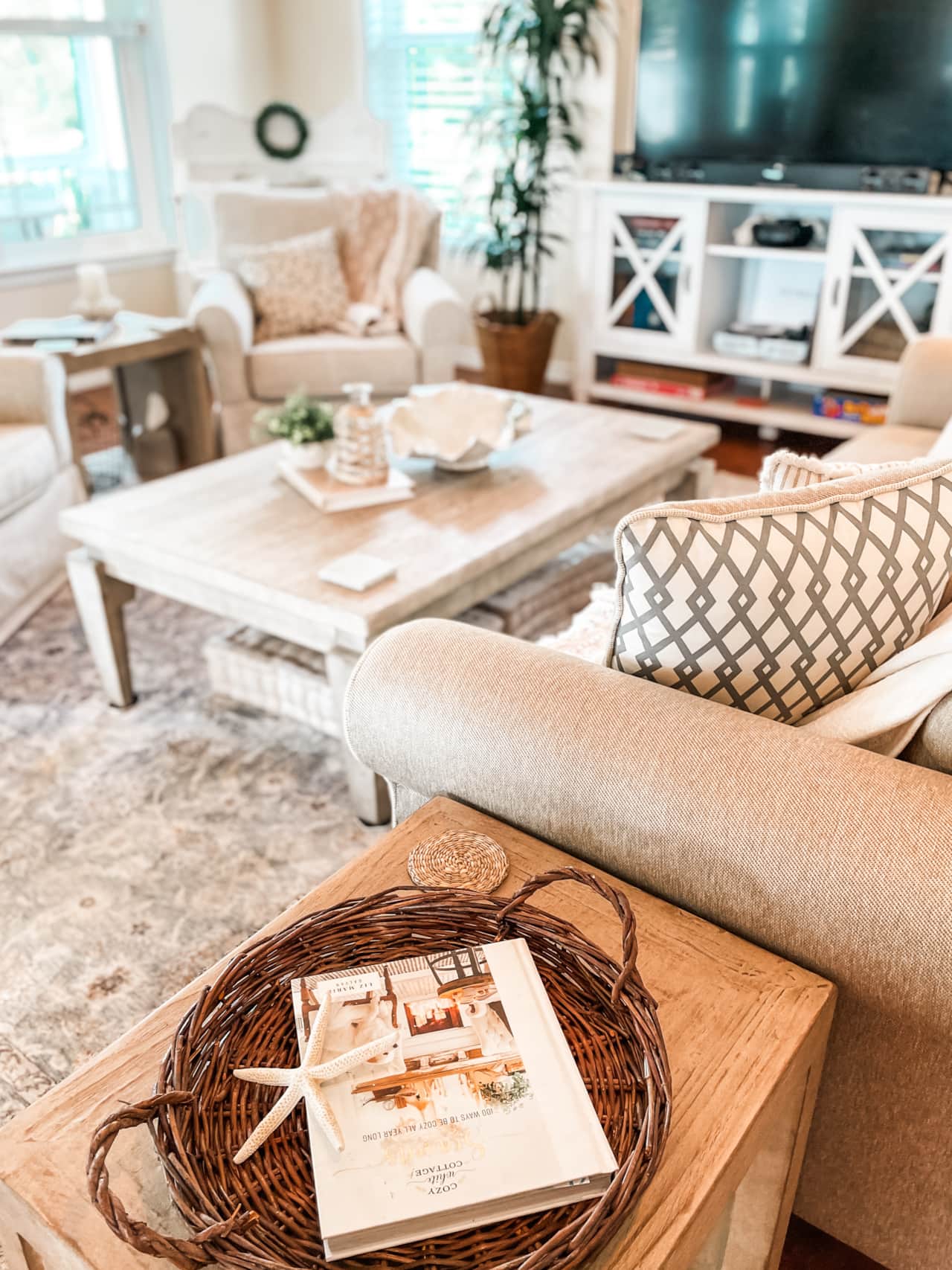 A plush sleeper sofa and swivel armchairs, thoughtfully arranged around a stylish wood coffee table.