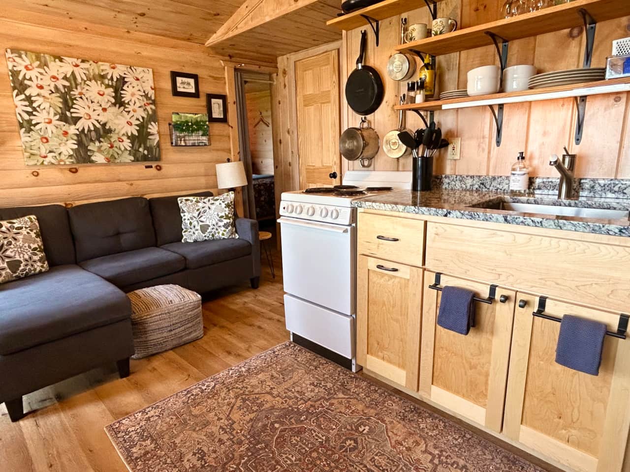 Seating for 3 on the couch. Table with tucked under bench for seating for 4. Gorgeous lake veiws.