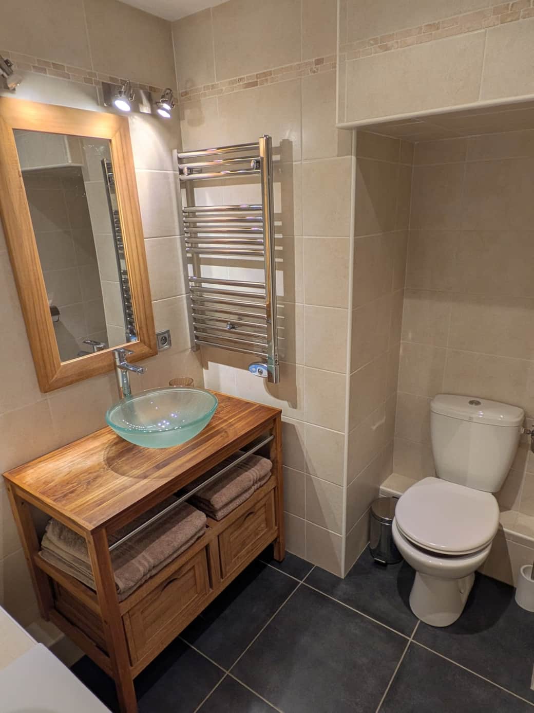 The toilet is located in the bathroom.