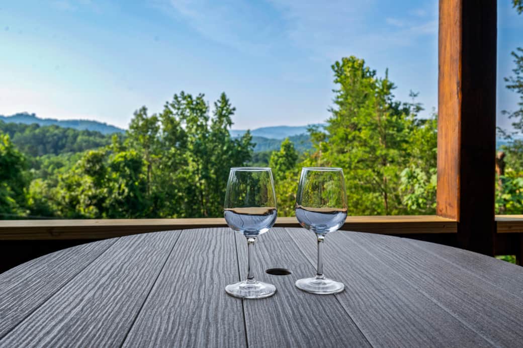 Sip and savor the view—this cozy pub table for two overlooks stunning Smoky Mountain vistas.