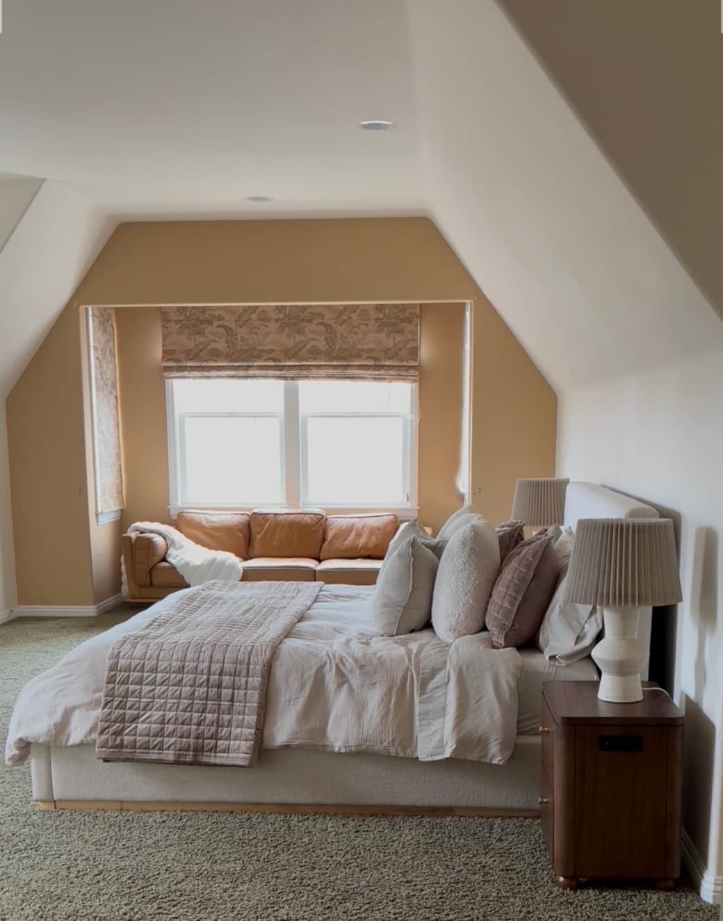 Main bedroom en suite with king bed, fire place and leather Article couch with all the lake views and sun exposure 