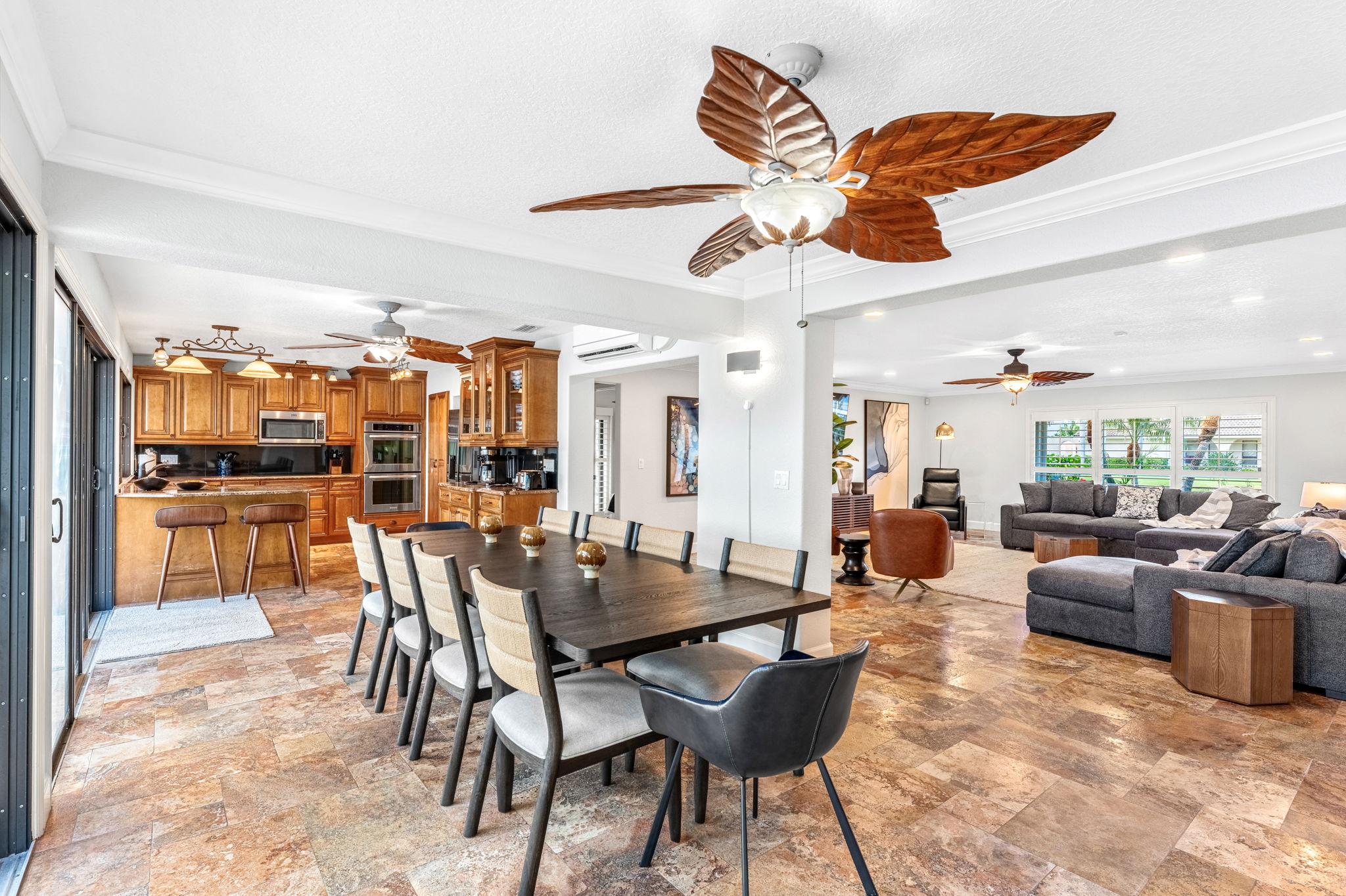 Gather around the elegant dining table with plenty of seating, ideal for meals and quality time.