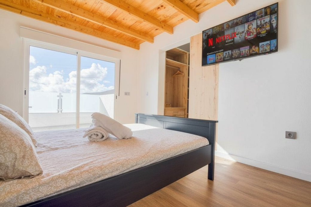 Bright Bedroom with Balcony View