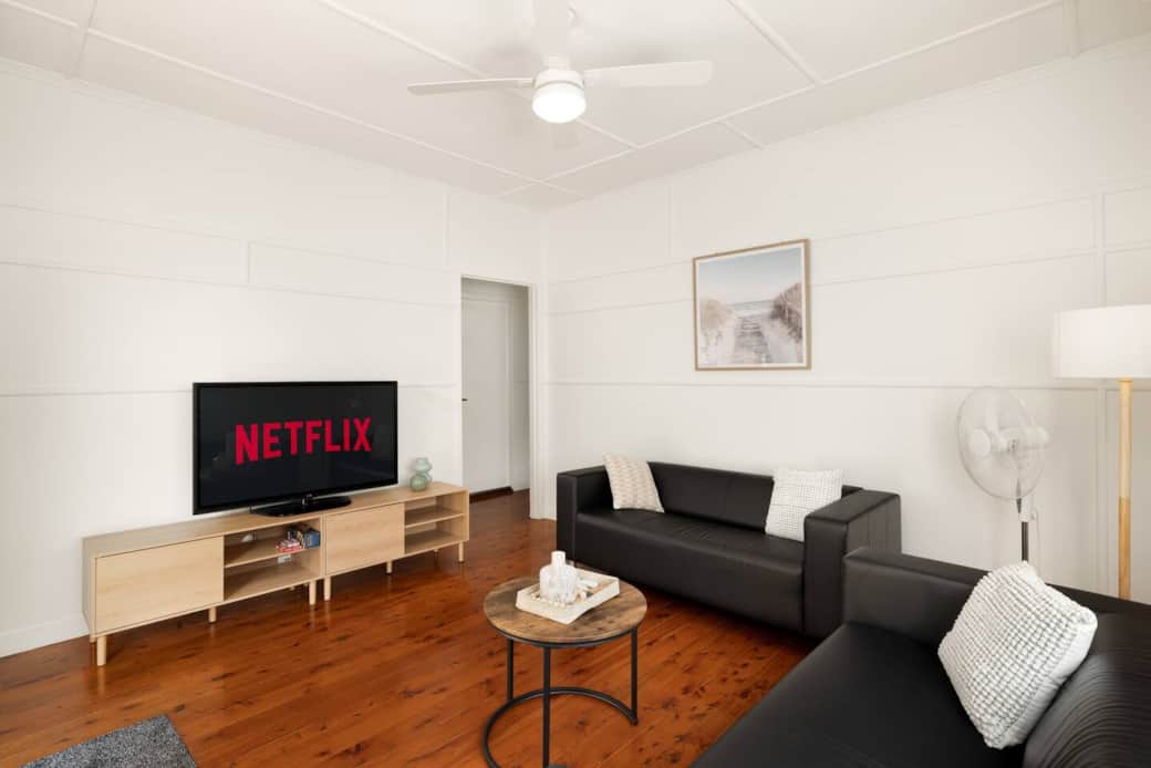 Living Area: Bright living space with comfortable seating and TV Living Area: Bright living space with comfortable seating and TV