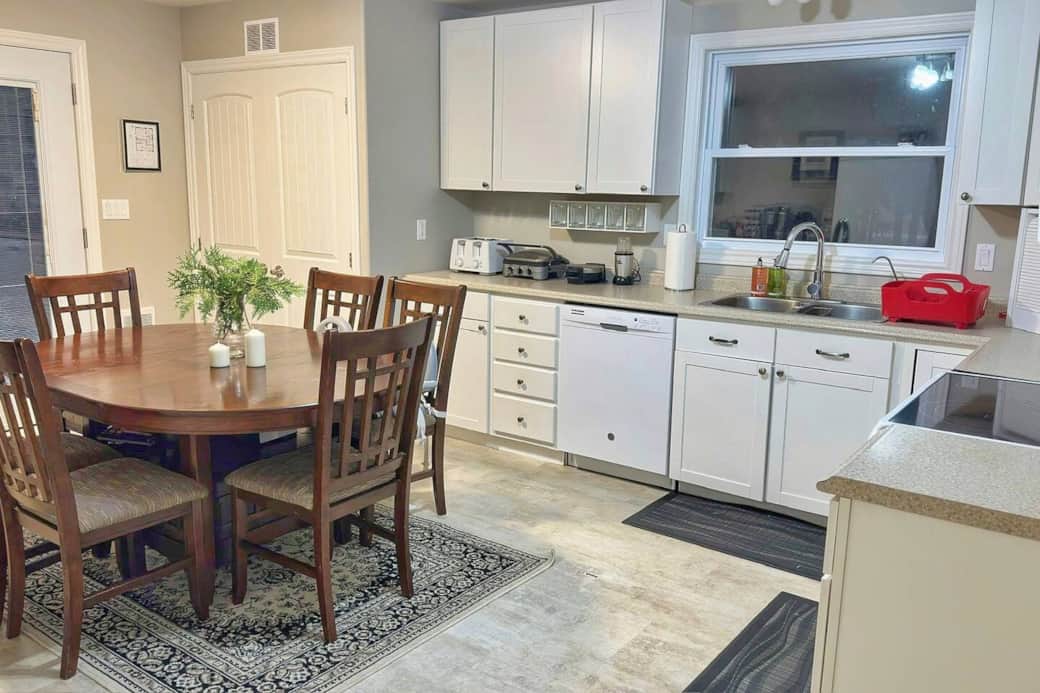 Modern kitchen setup with toaster, griddle, blender, dishwasher, and everything you need for cooking.